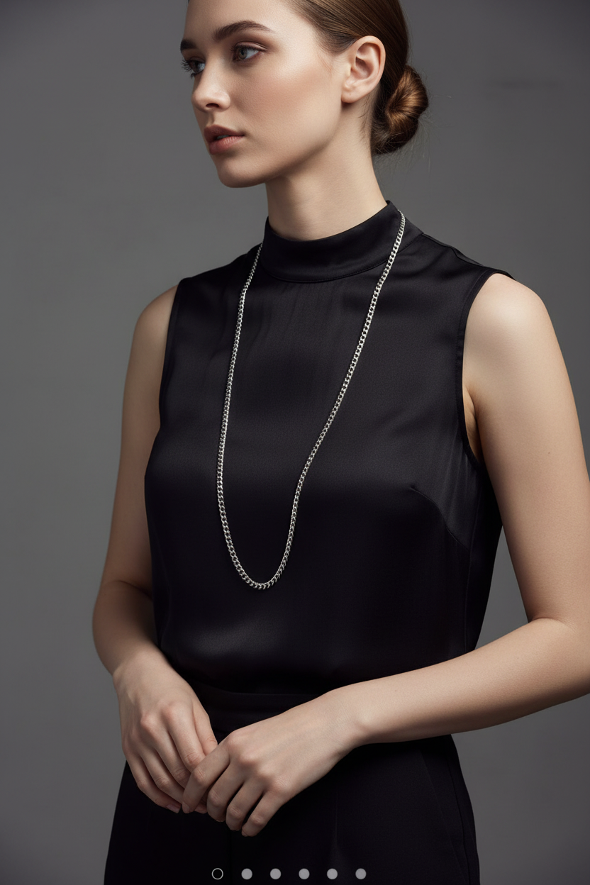 Long silver chain on black shirt