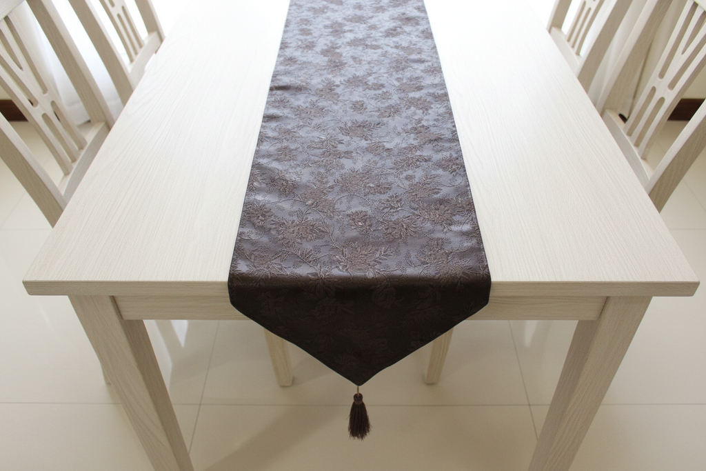 Top view of brown faux leather table runner on light table